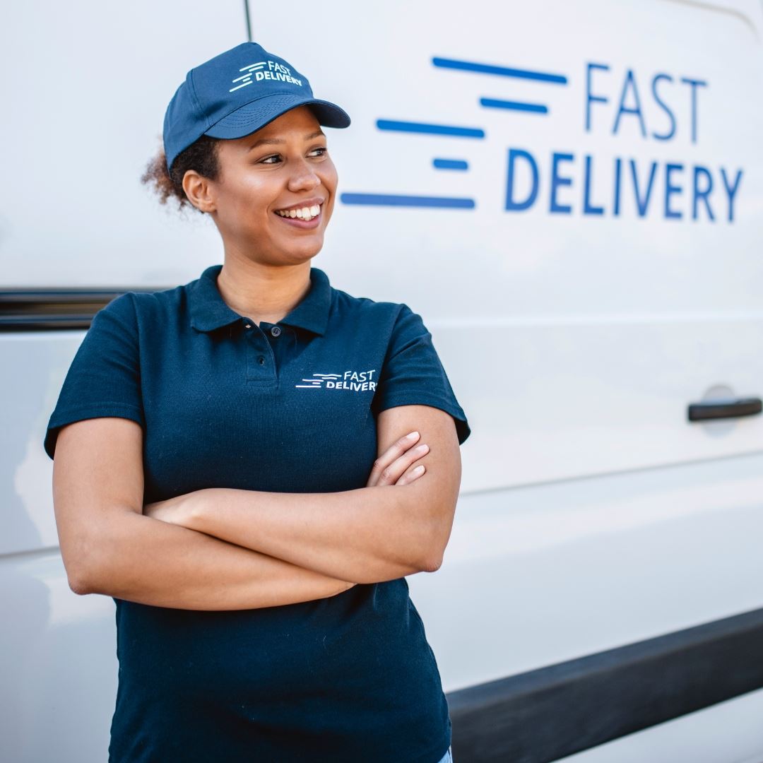 business woman in front of her branded truck