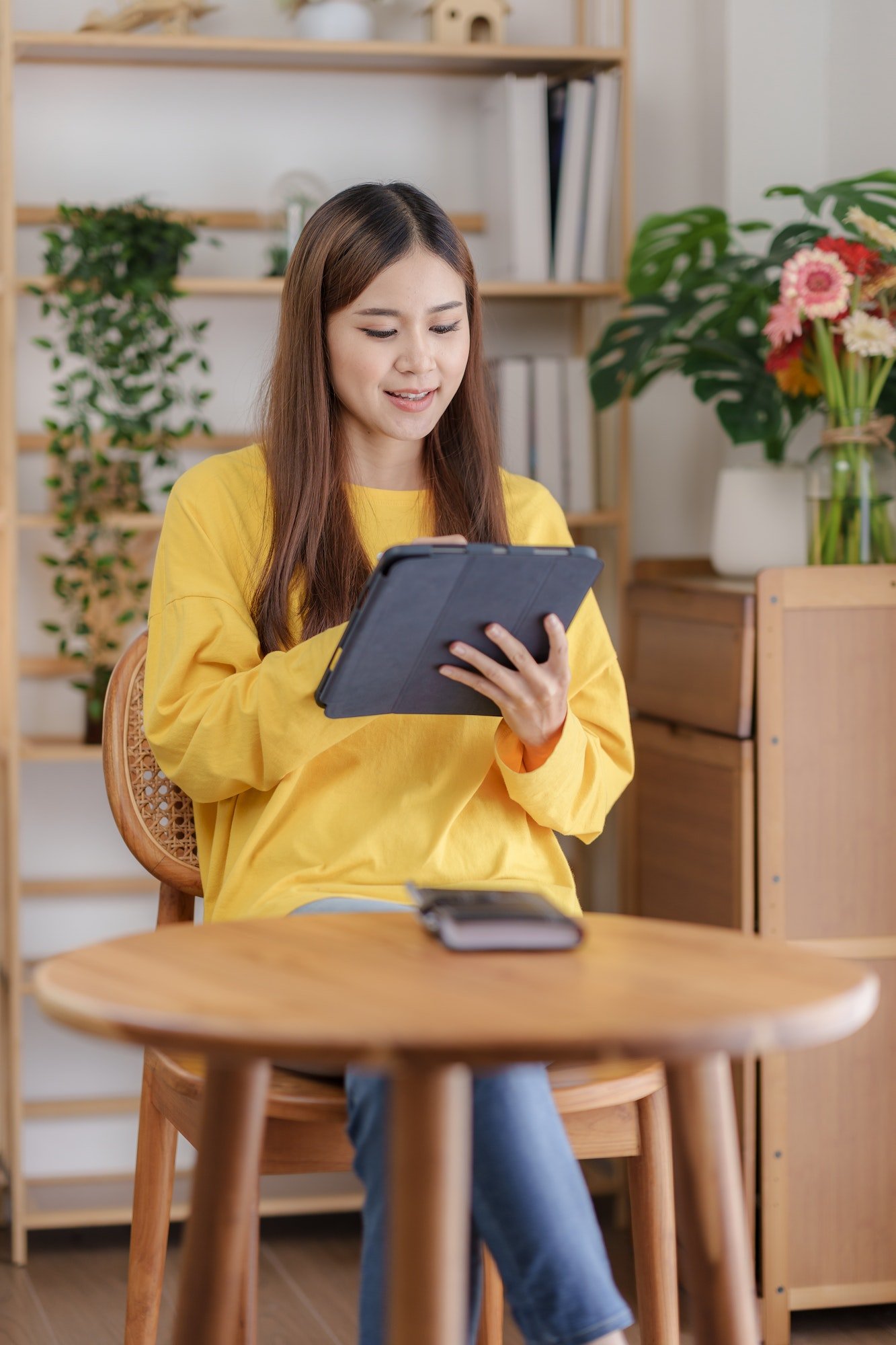 beautiful-asian-business-woman-working-at-home-using-digital-tablet-with-peace-of-mind-.jpg